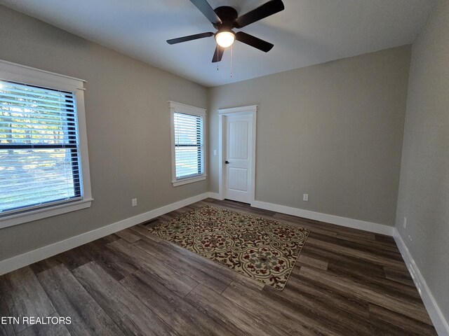 708 Lakeside Ct, Dandridge, TN 37725 - spare room featuring dark wood-style floors, ceiling fan, and baseboards