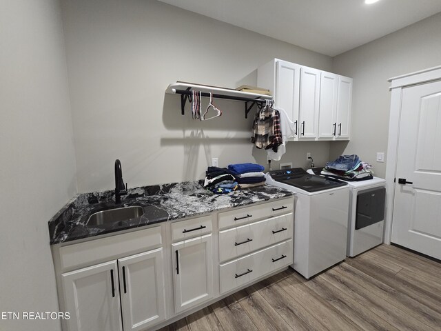 708 Lakeside Ct, Dandridge, TN 37725 - laundry room with washing machine and dryer, cabinet space, and wood finished floors