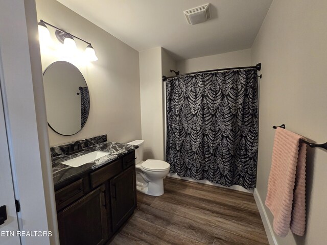 708 Lakeside Ct, Dandridge, TN 37725 - bathroom with vanity, toilet, wood finished floors, and a shower with shower curtain