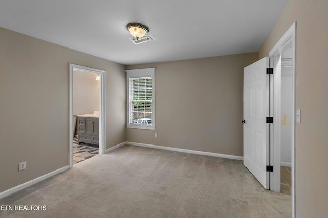 4914 Circle Rd, Corryton, TN 37721 - unfurnished bedroom with light colored carpet, baseboards, and ensuite bath