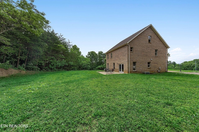 4914 Circle Rd, Corryton, TN 37721 - view of side of property featuring a lawn, brick siding, and a patio area