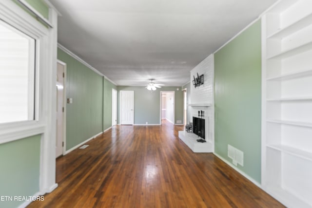 104 Carlisle Ln, Oak Ridge, TN 37830 - unfurnished living room with a fireplace, a ceiling fan, built in features, ornamental molding, and wood finished floors