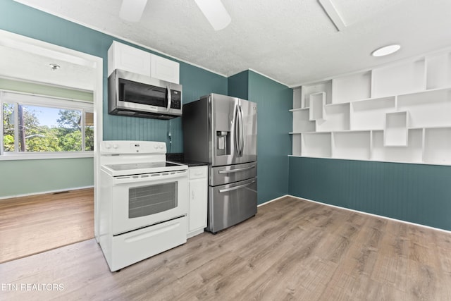 104 Carlisle Ln, Oak Ridge, TN 37830 - kitchen featuring stainless steel appliances, light wood finished floors, white cabinetry, a textured ceiling, and open shelves