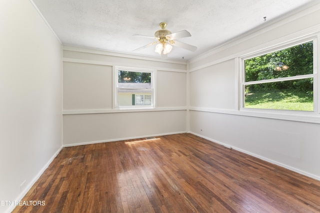 104 Carlisle Ln, Oak Ridge, TN 37830 - empty room with healthy amount of natural light, hardwood / wood-style flooring, a ceiling fan, baseboards, and a textured ceiling