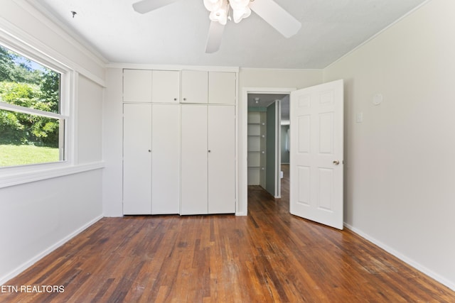 104 Carlisle Ln, Oak Ridge, TN 37830 - unfurnished bedroom featuring dark wood finished floors, a closet, baseboards, and ceiling fan