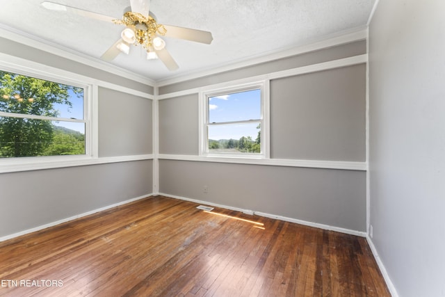104 Carlisle Ln, Oak Ridge, TN 37830 - empty room with plenty of natural light, hardwood / wood-style flooring, baseboards, crown molding, and ceiling fan