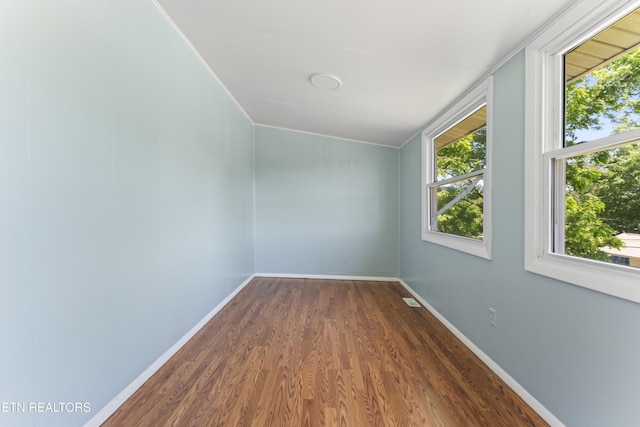 104 Carlisle Ln, Oak Ridge, TN 37830 - spare room featuring dark wood-type flooring, baseboards, and ornamental molding
