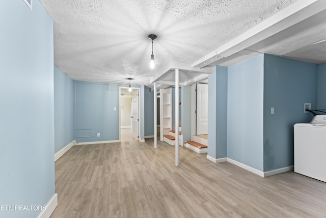 104 Carlisle Ln, Oak Ridge, TN 37830 - finished basement with washer / clothes dryer, wood finished floors, a textured ceiling, and baseboards