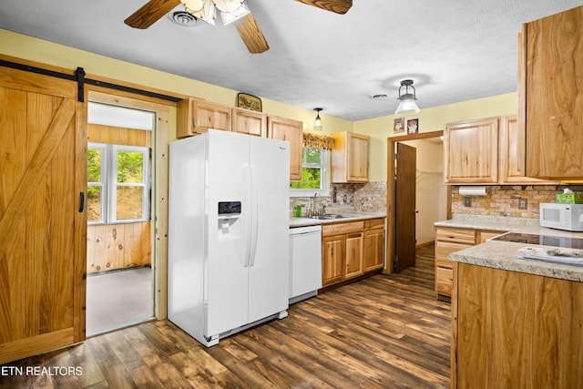 3305 Leonard Huskey Ln, Pigeon Forge, TN 37863 - kitchen with white appliances, dark wood finished floors, tasteful backsplash, a sink, and ceiling fan