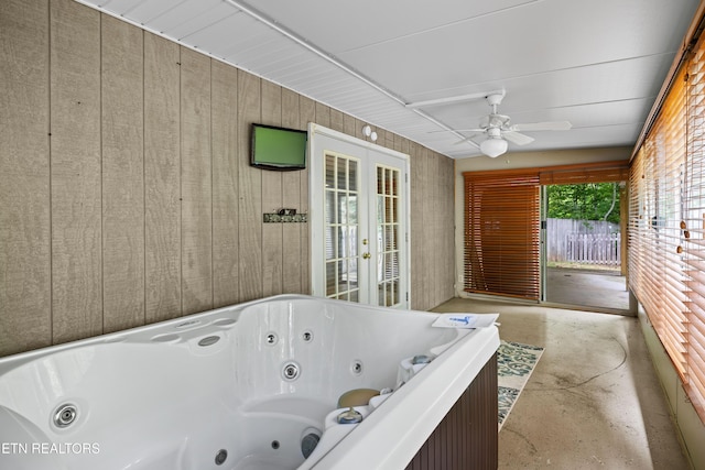 3305 Leonard Huskey Ln, Pigeon Forge, TN 37863 - full bathroom with a jetted tub, french doors, concrete floors, and a ceiling fan