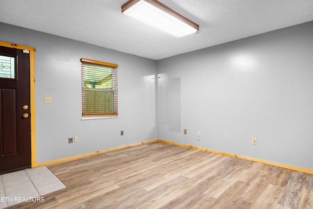 3305 Leonard Huskey Ln, Pigeon Forge, TN 37863 - spare room featuring wood finished floors, a textured ceiling, and baseboards
