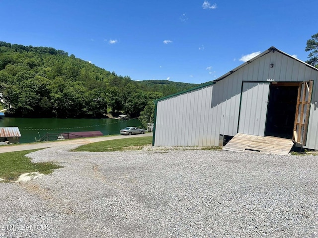 645 Blue Springs Rd, Speedwell, TN 37870 - view of pole building featuring a forest view and a water view