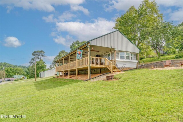 645 Blue Springs Rd, Speedwell, TN 37870 - rear view of property featuring a lawn and a wooden deck