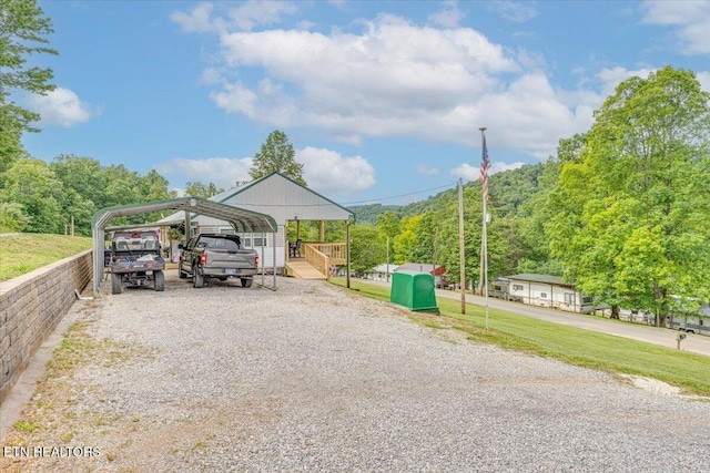 645 Blue Springs Rd, Speedwell, TN 37870 - view of car parking featuring a carport and driveway