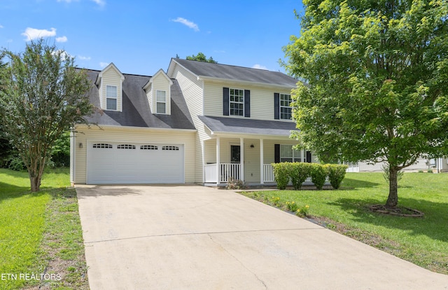 6108 Burlwood Rd, Knoxville, TN 37921 - view of front of home with a porch, a garage, driveway, and a front lawn