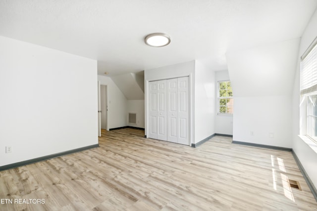 6108 Burlwood Rd, Knoxville, TN 37921 - unfurnished living room featuring wood finished floors, baseboards, and lofted ceiling