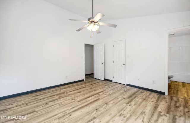 6108 Burlwood Rd, Knoxville, TN 37921 - unfurnished bedroom with light wood-style floors, baseboards, ensuite bath, a ceiling fan, and a high ceiling