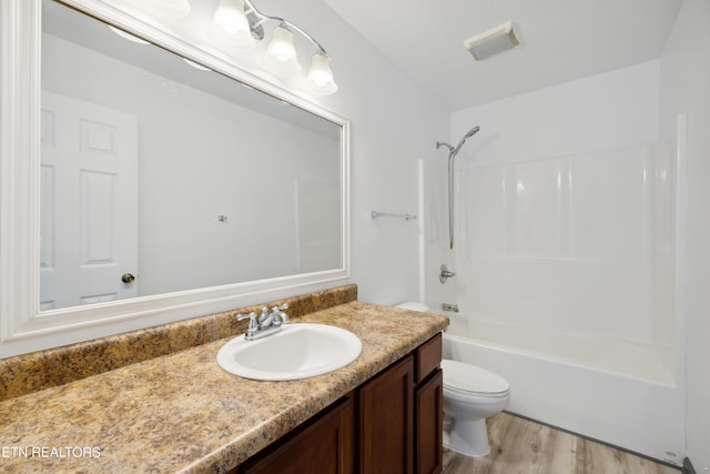 6108 Burlwood Rd, Knoxville, TN 37921 - full bathroom with toilet, vanity, shower / bath combination, and wood finished floors