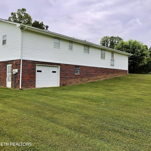 312 Terrace View Dr, Bean Station, TN 37708 - rear view of house with an attached garage, a lawn, and brick siding
