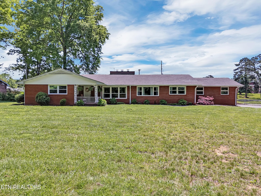 1720 Nobel St, Alcoa, TN 37701 - ranch-style house featuring a front yard, a porch, and brick siding