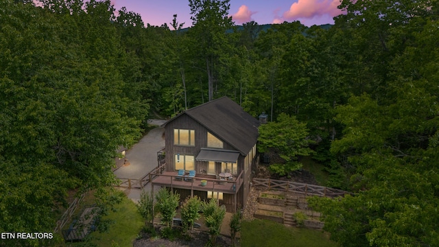 1907 Oakwood Rd, Walland, TN 37886 - back of house at dusk with a deck and a forest view