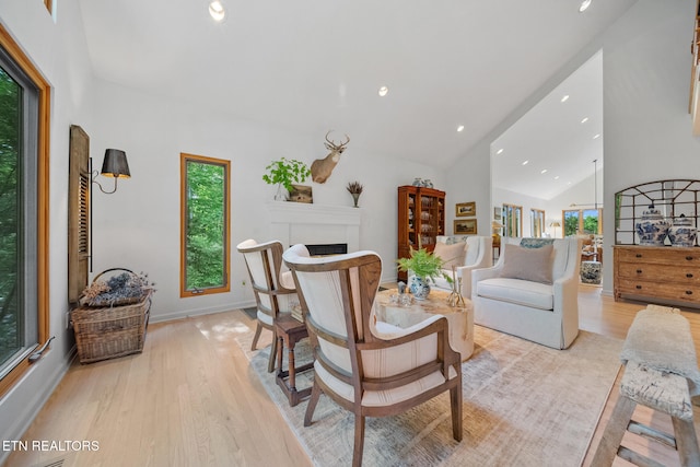 1907 Oakwood Rd, Walland, TN 37886 - living room with light wood finished floors, a fireplace, recessed lighting, baseboards, and high vaulted ceiling