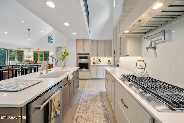 1907 Oakwood Rd, Walland, TN 37886 - kitchen with a sink, stainless steel appliances, plenty of natural light, extractor fan, and high vaulted ceiling