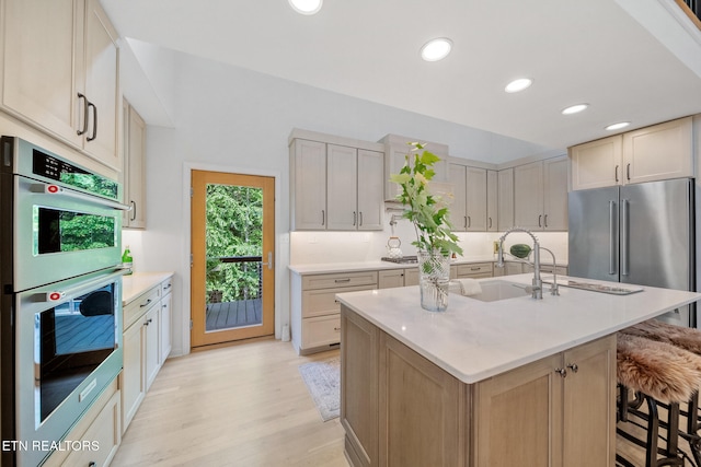 1907 Oakwood Rd, Walland, TN 37886 - kitchen featuring appliances with stainless steel finishes, light countertops, recessed lighting, light wood finished floors, and a kitchen bar