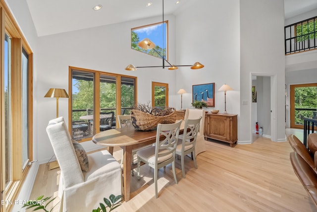 1907 Oakwood Rd, Walland, TN 37886 - dining area with high vaulted ceiling, light wood-type flooring, baseboards, and recessed lighting
