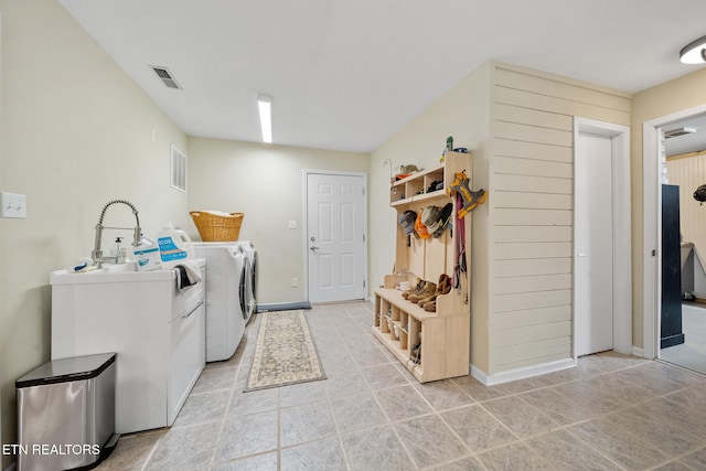 1907 Oakwood Rd, Walland, TN 37886 - laundry area with separate washer and dryer, light tile patterned floors, and baseboards