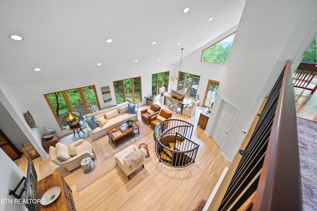 1907 Oakwood Rd, Walland, TN 37886 - sunken living room featuring plenty of natural light, recessed lighting, light wood finished floors, high vaulted ceiling, and a fireplace