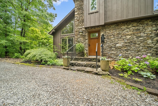 1907 Oakwood Rd, Walland, TN 37886 - doorway to property featuring stone siding and board and batten siding