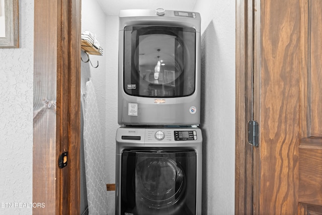 2046 Slippery Rock Cir, Sevierville, TN 37862 - laundry room with stacked washer and clothes dryer and a textured wall