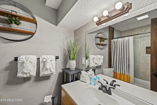 2046 Slippery Rock Cir, Sevierville, TN 37862 - full bath with a textured wall, vanity, toilet, and shower / tub combo with curtain