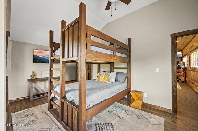 2046 Slippery Rock Cir, Sevierville, TN 37862 - bedroom featuring wood finished floors, vaulted ceiling, a ceiling fan, and baseboards