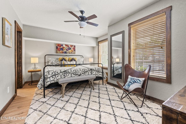 2046 Slippery Rock Cir, Sevierville, TN 37862 - bedroom with wood finished floors, baseboards, and ceiling fan