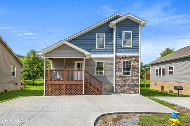 2046 Slippery Rock Cir, Sevierville, TN 37862 - view of front of home with stone siding, covered porch, and a front yard