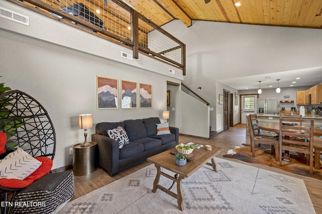 2046 Slippery Rock Cir, Sevierville, TN 37862 - living room featuring wood finished floors, recessed lighting, baseboards, high vaulted ceiling, and wooden ceiling with exposed beams