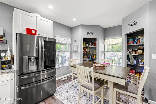 1947 Oneil Rd, Newport, TN 37821 - kitchen featuring stainless steel refrigerator with ice dispenser, dark wood-style floors, white cabinets, healthy amount of natural light, and recessed lighting