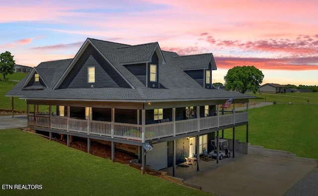 1947 Oneil Rd, Newport, TN 37821 - rear view of house featuring a yard, a patio area, a garage, a shingled roof, and driveway