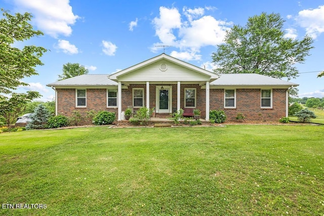 1000 Burgess Mills Rd, Cookeville, TN 38506 - view of front of home featuring a front yard, brick siding, and covered porch