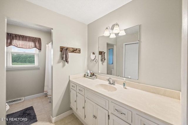 1000 Burgess Mills Rd, Cookeville, TN 38506 - full bath with toilet, vanity, baseboards, and a shower with shower curtain
