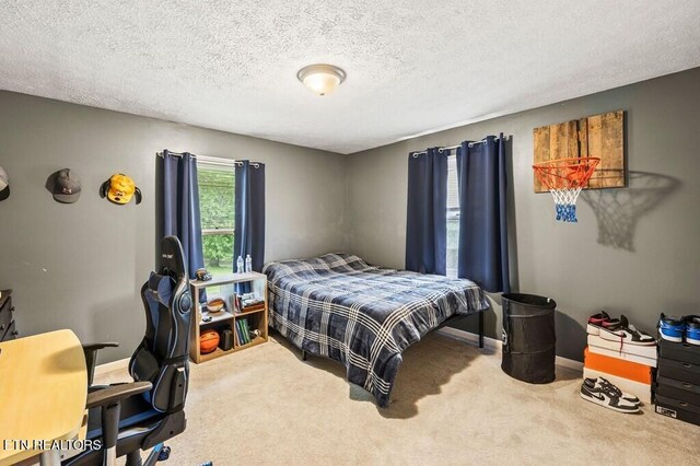 1000 Burgess Mills Rd, Cookeville, TN 38506 - carpeted bedroom with multiple windows, an office area, a textured ceiling, and baseboards