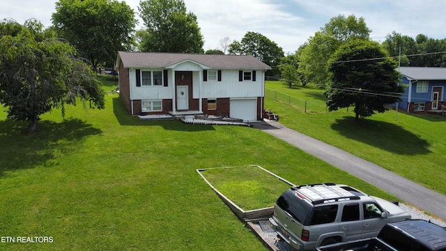 1336 Tom Breeden Rd, Jefferson City, TN 37760 - raised ranch featuring brick siding, driveway, and an attached garage