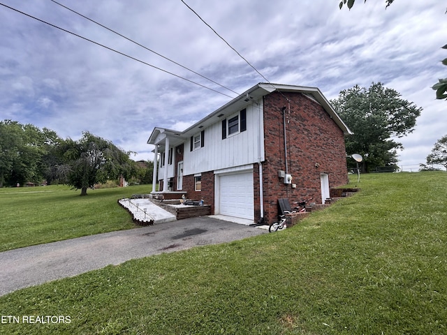 1336 Tom Breeden Rd, Jefferson City, TN 37760 - view of side of home featuring brick siding, a yard, driveway, and an attached garage