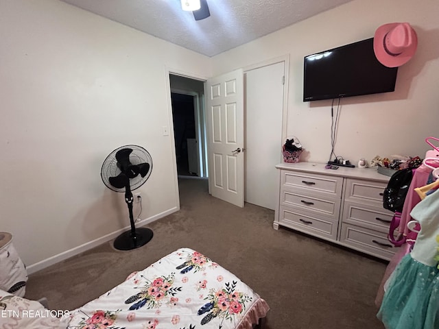 1336 Tom Breeden Rd, Jefferson City, TN 37760 - bedroom featuring dark colored carpet, a textured ceiling, a ceiling fan, and baseboards
