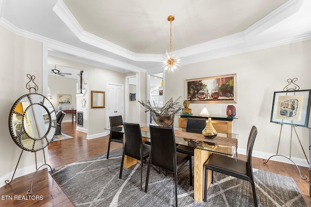 105 Gogeyi Trl, Vonore, TN 37885 - dining space featuring ornamental molding, a raised ceiling, wood finished floors, and baseboards