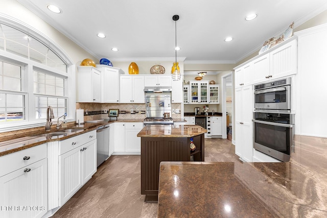 105 Gogeyi Trl, Vonore, TN 37885 - kitchen featuring under cabinet range hood, appliances with stainless steel finishes, a sink, ornamental molding, and white cabinets