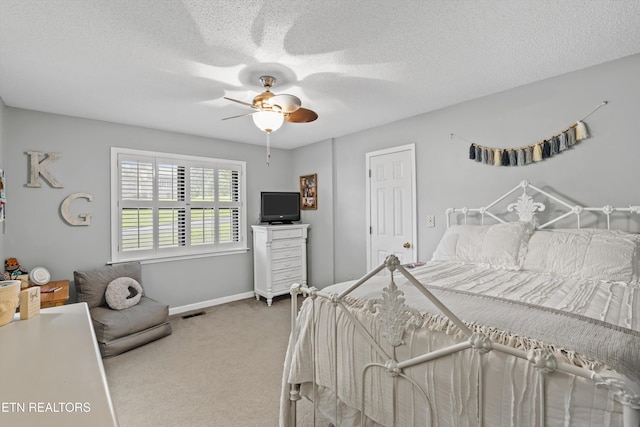 1420 Brentwood Dr, Athens, TN 37303 - carpeted bedroom with baseboards, a ceiling fan, and a textured ceiling