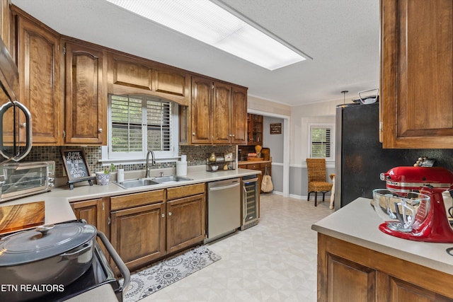 1420 Brentwood Dr, Athens, TN 37303 - kitchen featuring stainless steel appliances, a sink, light floors, tasteful backsplash, and beverage cooler